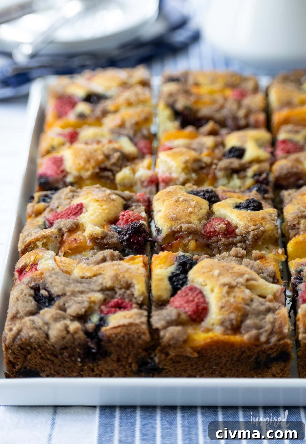large platter of Nectarine and Berry Buckle cut into pieces.