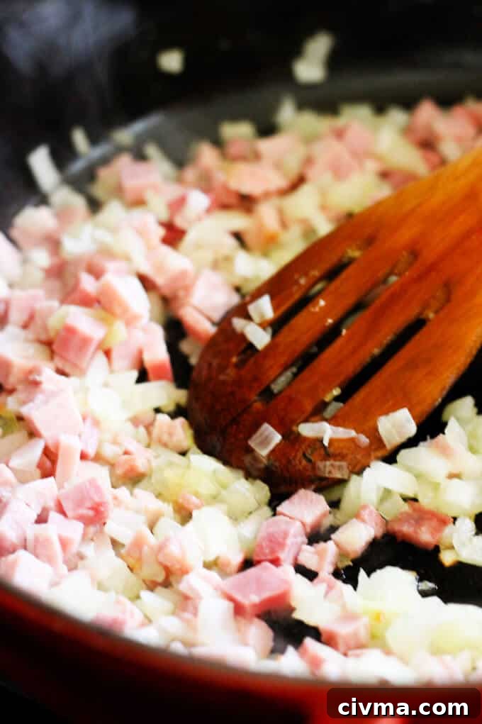 ham and onions sautéed on a pan