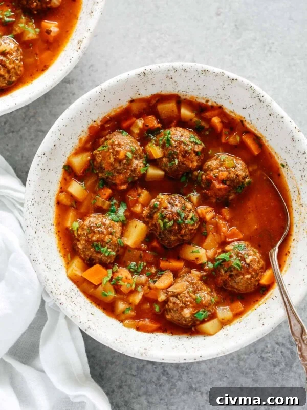 overhead view of a white bowl containing Meatball soup