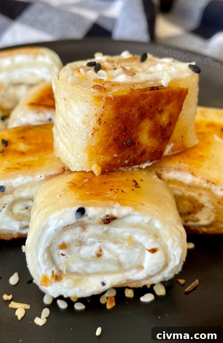 Crispy Bagel Bites are a fun and easy snack recipe made with just a few ingredients including flour tortillas, cream cheese, butter, and Everything Bagel seasoning. They are great as a quick breakfast, after school snack, or delicious treat anytime of day! My kids especially love them. 