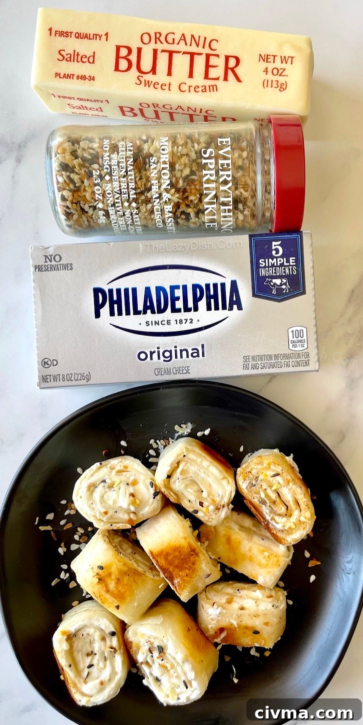 Crispy Bagel Bites | Large flour tortillas rolled up with cream cheese and Everything Bagel seasoning, cut into bite size pieces, and then cooked in a frying pan with butter until golden brown and crispy. So yummy! My kids love it when I make these for breakfast, but they are also the perfect snack for anytime of day. 