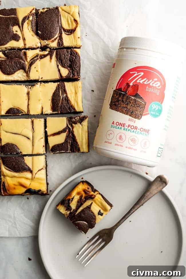 Keto Cheesecake Brownies Recipe 4 cheesecake on plate with bottle of nuvia baking blend