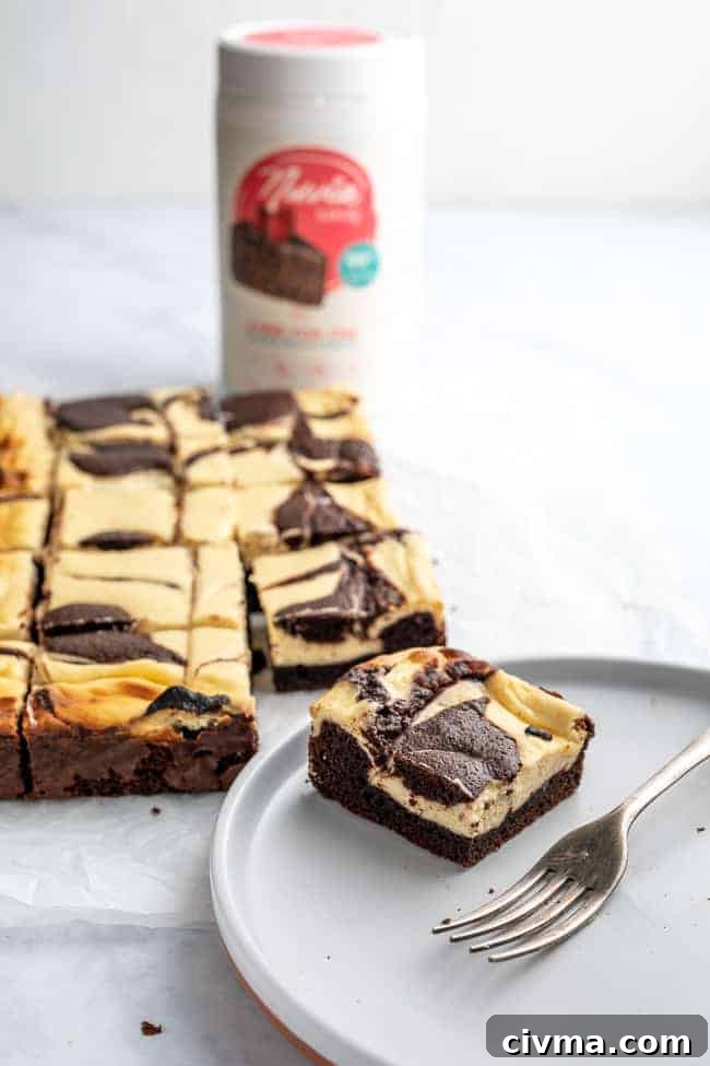 Keto Cheesecake Brownies Recipe 5 cheesecake brownie on a plate with a fork