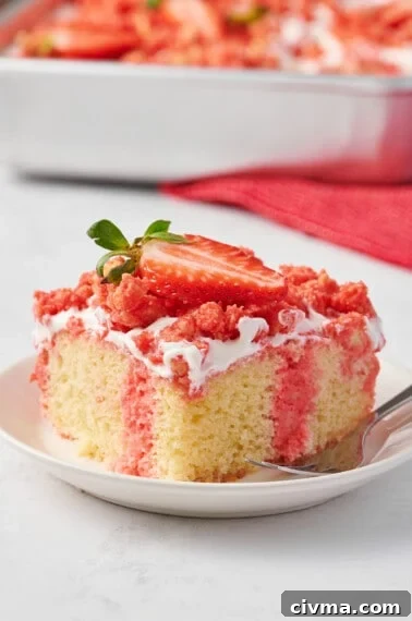 A slice of strawberry crunch poke cake on a plate.