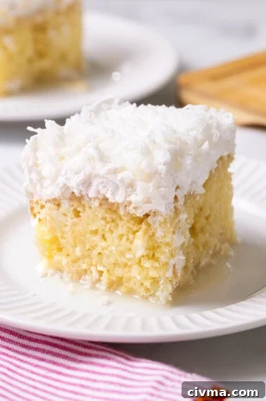 Coconut poke cake made with box cake mix.
