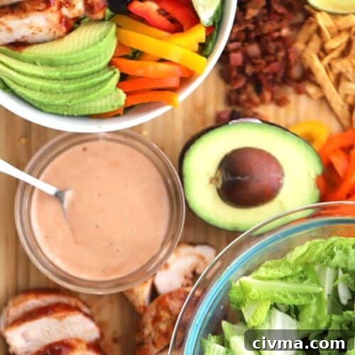 Salad ingredients are grilled chicken, loads of veggies and plenty of tangy BBQ ranch dressing