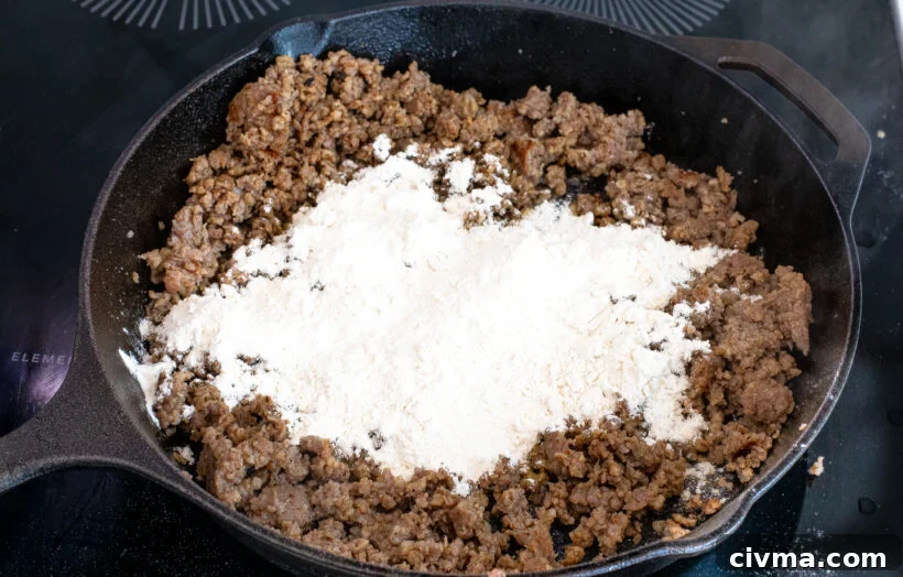 Flour and sausage in a pan.