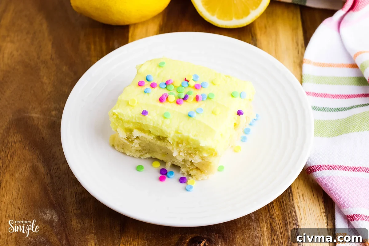 Lemon Cookie Bars with Zesty Lemon Buttercream 3 Lemon Cookie Bars With Sprinkles on white plate