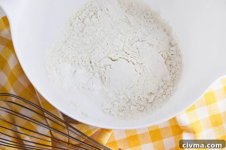 Lemon Cookie Bars with Zesty Lemon Buttercream 4 Whisk flour baking powder and salt in bowl