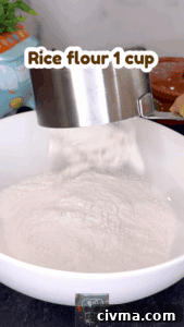 Mixing rice flour, sesame oil, and salt for idiyappam dough