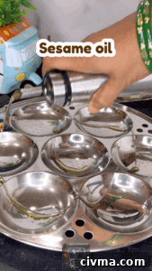 Greasing idli plate with sesame oil for idiyappam