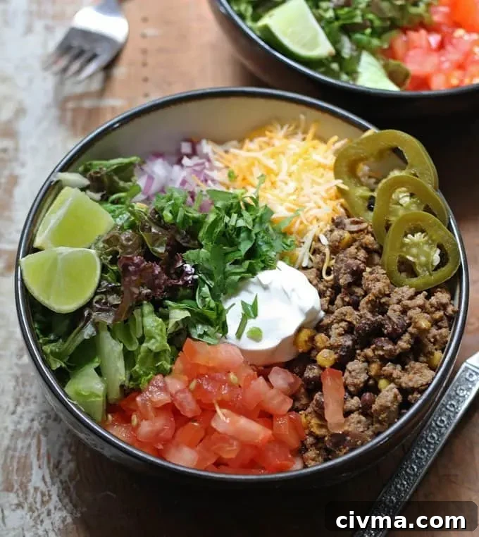 Burrito bowl with rice, beans, and toppings