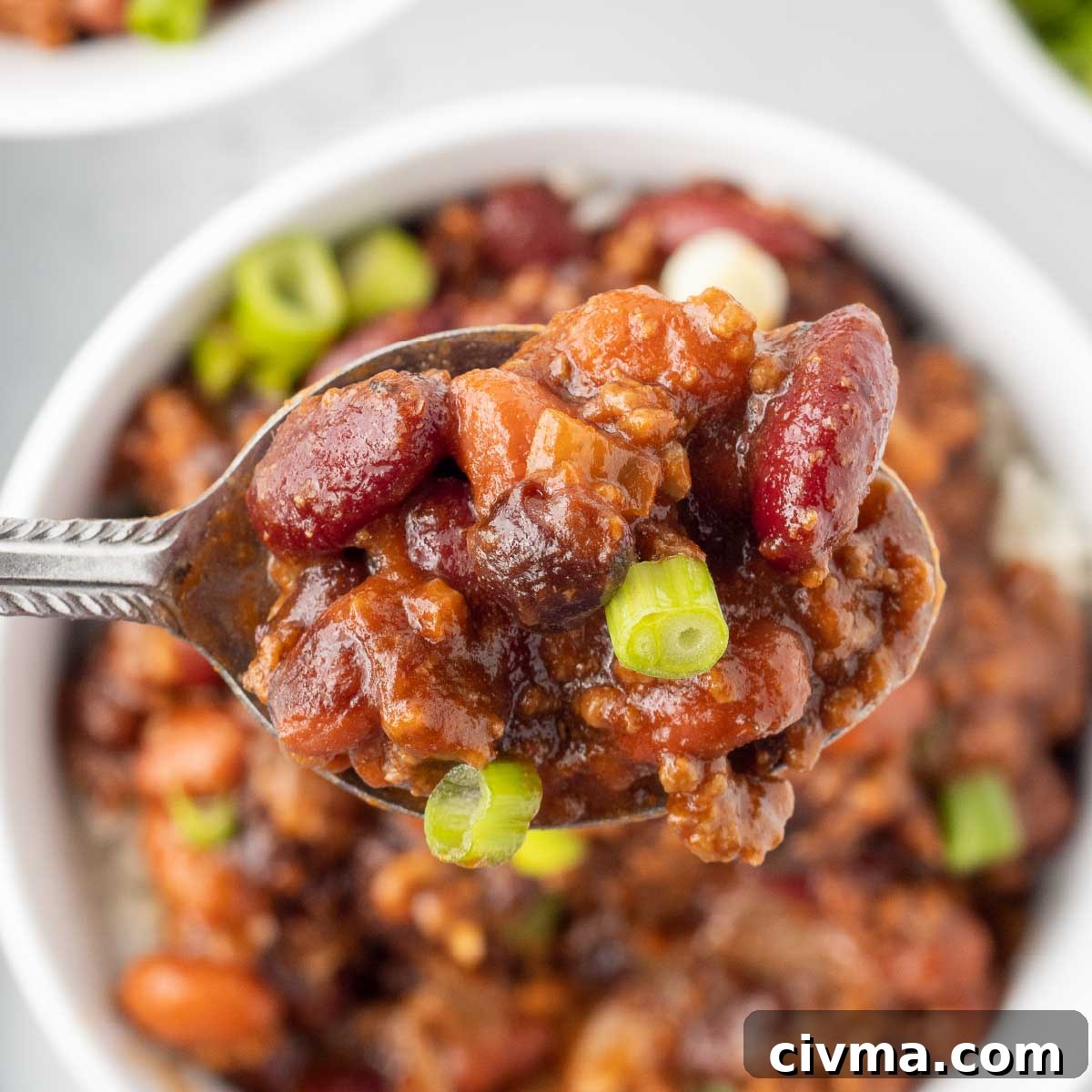 30 Minute BBQ Beef and Beans Recipe 2 Spoonful of beef and beans garnished with green onion