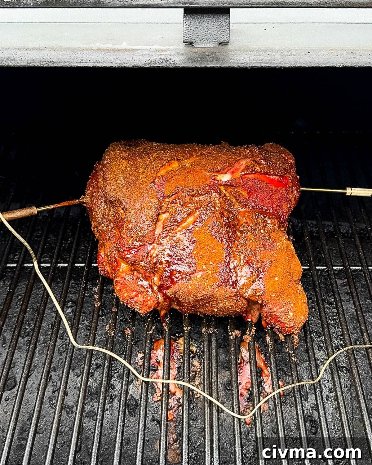 The pork shoulder on the grill just before wrapping.