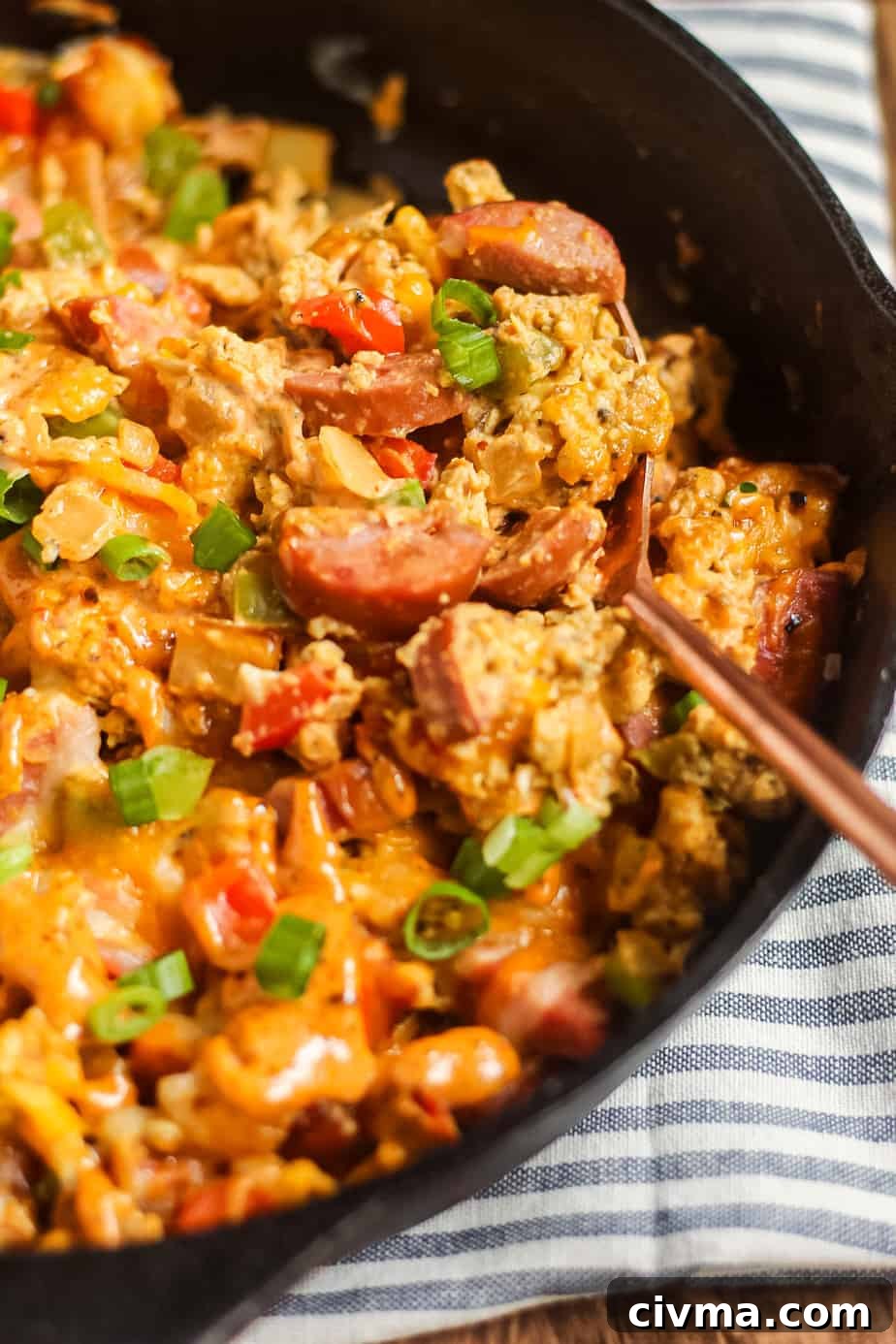 Close-up angled shot of a loaded Creole breakfast skillet.