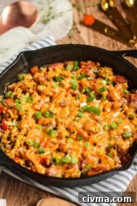 Angled shot of a loaded Creole breakfast skillet.