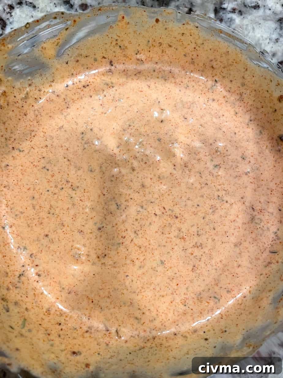 Overhead shot of Creole remoulade sauce in a bowl.