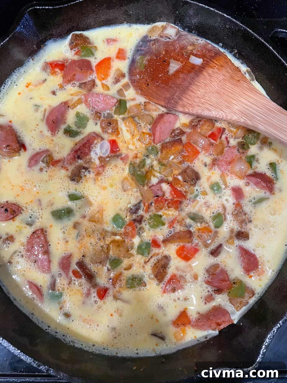 Eggs added to the breakfast skillet.