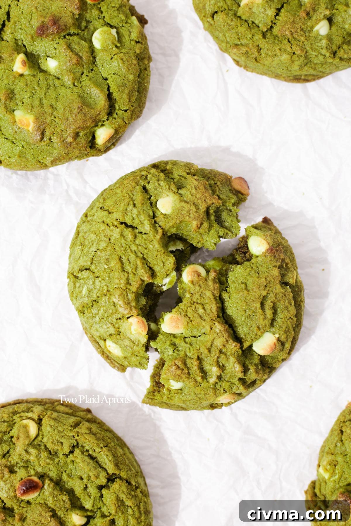 Soft Matcha White Chocolate Chip Cookies Recipe 8 Top down of matcha white chocolate cookie on tray.