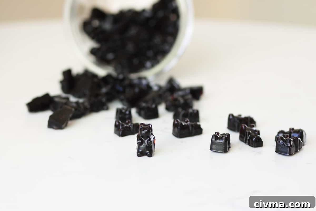 a jar of elderberry gummies spilled out on a counter