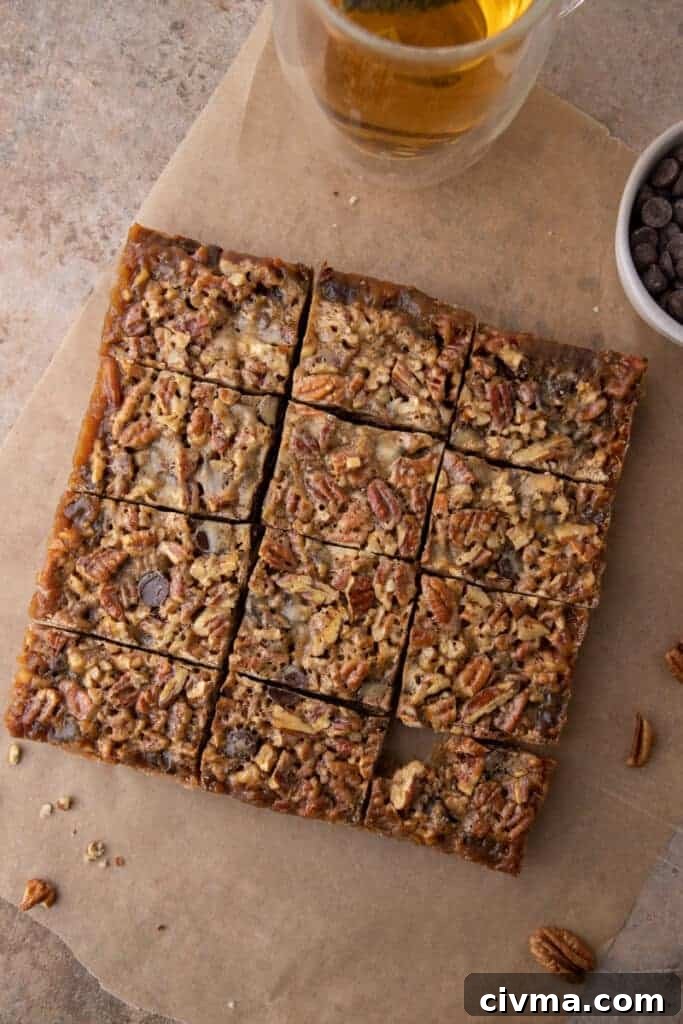 cooked and sliced chocolate pecan pie bars in the baking dish after going into the oven