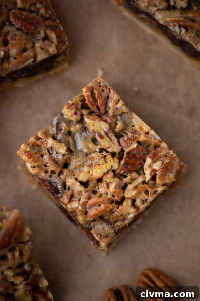 close up of a single chocolate pecan pie bar