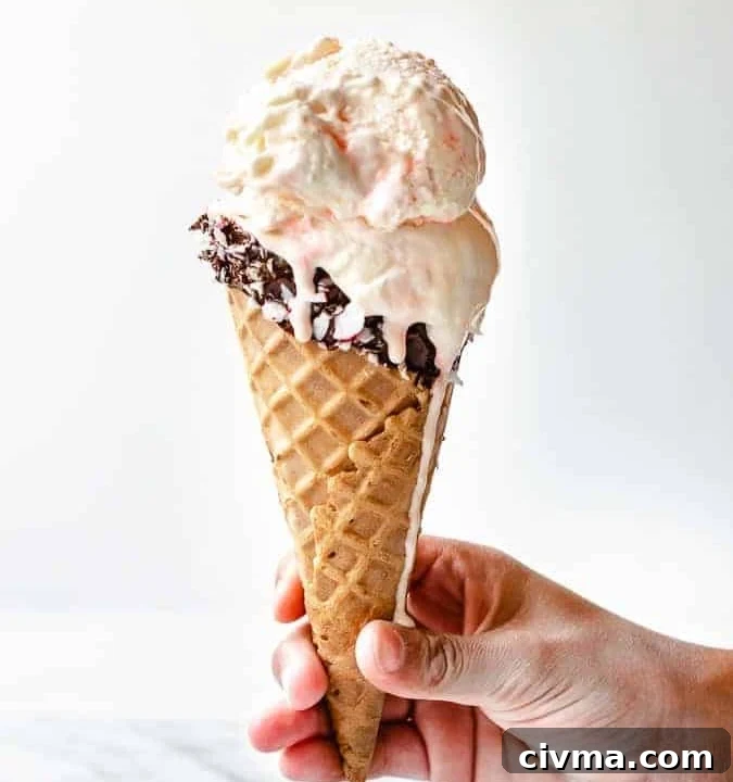 White Chocolate Peppermint Ice Cream in a chocolate dipped waffle cone