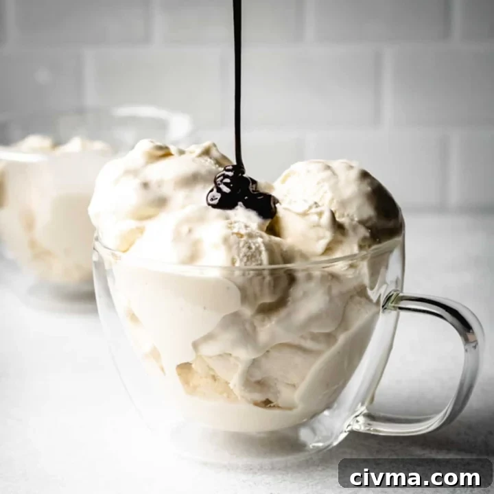 Drizzling homemade ice cream with hot fudge sauce.
