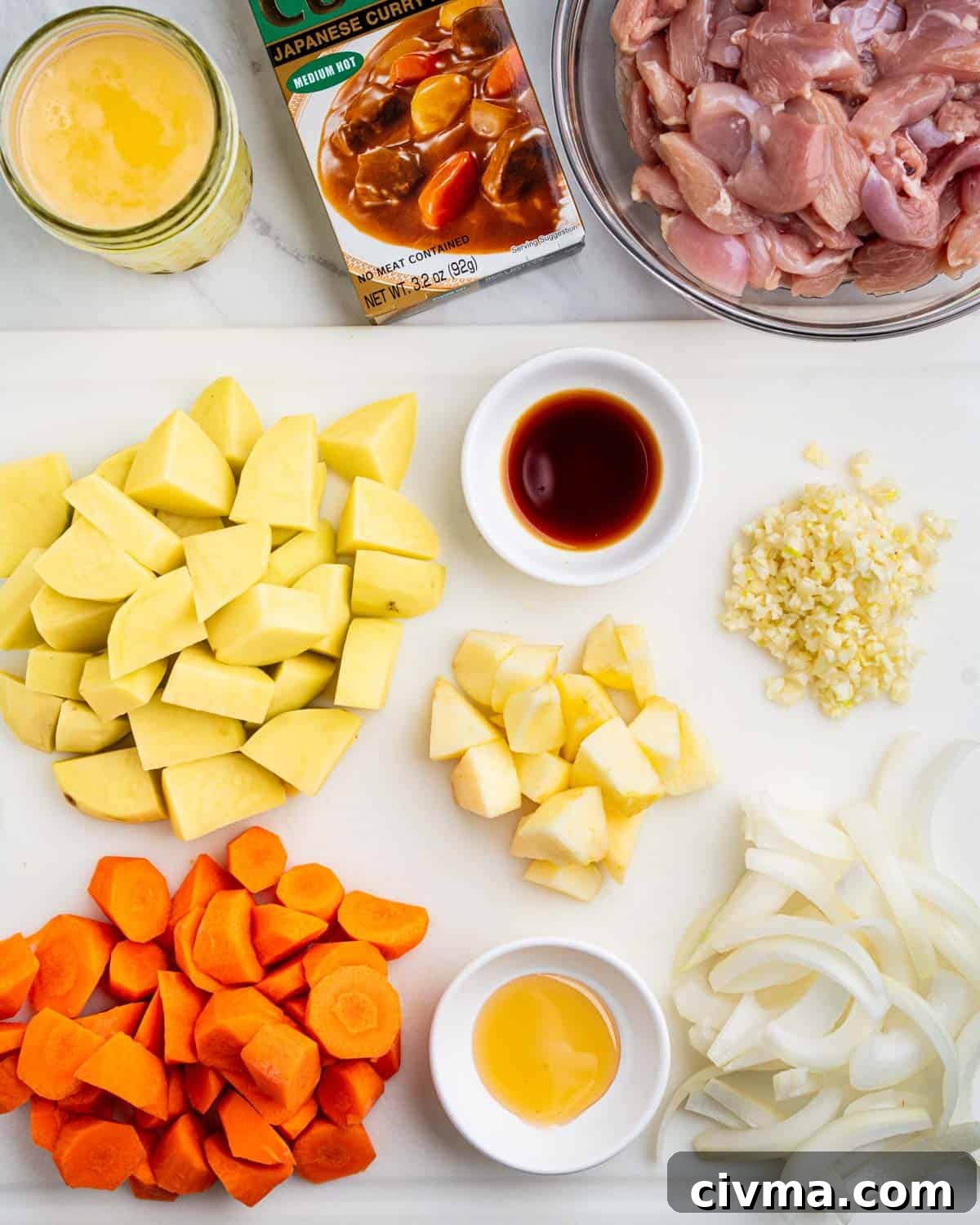 ingredients needed for Japanese chicken curry, chopped vegetables, curry roux package.