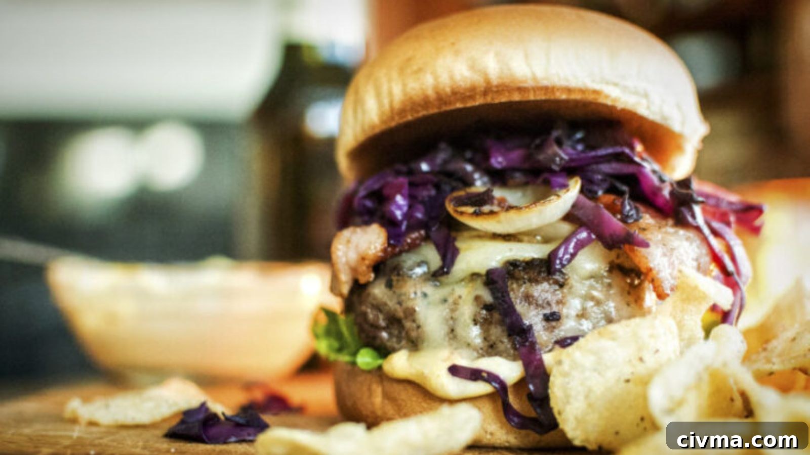 Brat burger topped with sauerkraut and mustard stacked tall on a toasted bun.