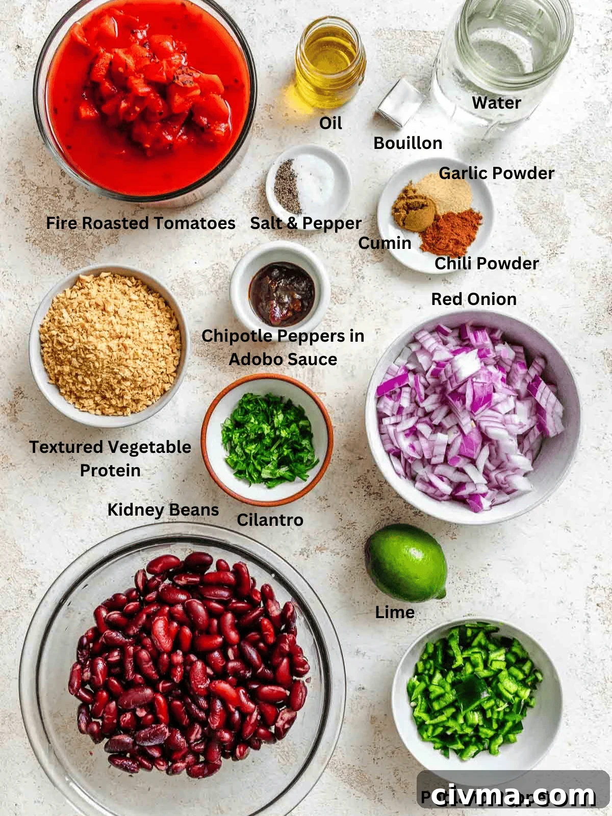 Ingredients for Chipotle Chili Recipe measured out on a white surface.
