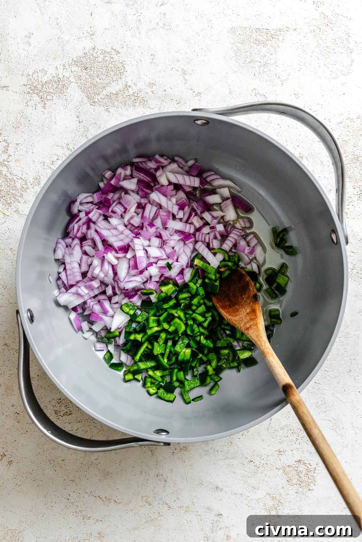 Process shot showing mixing ingredients in a pot.