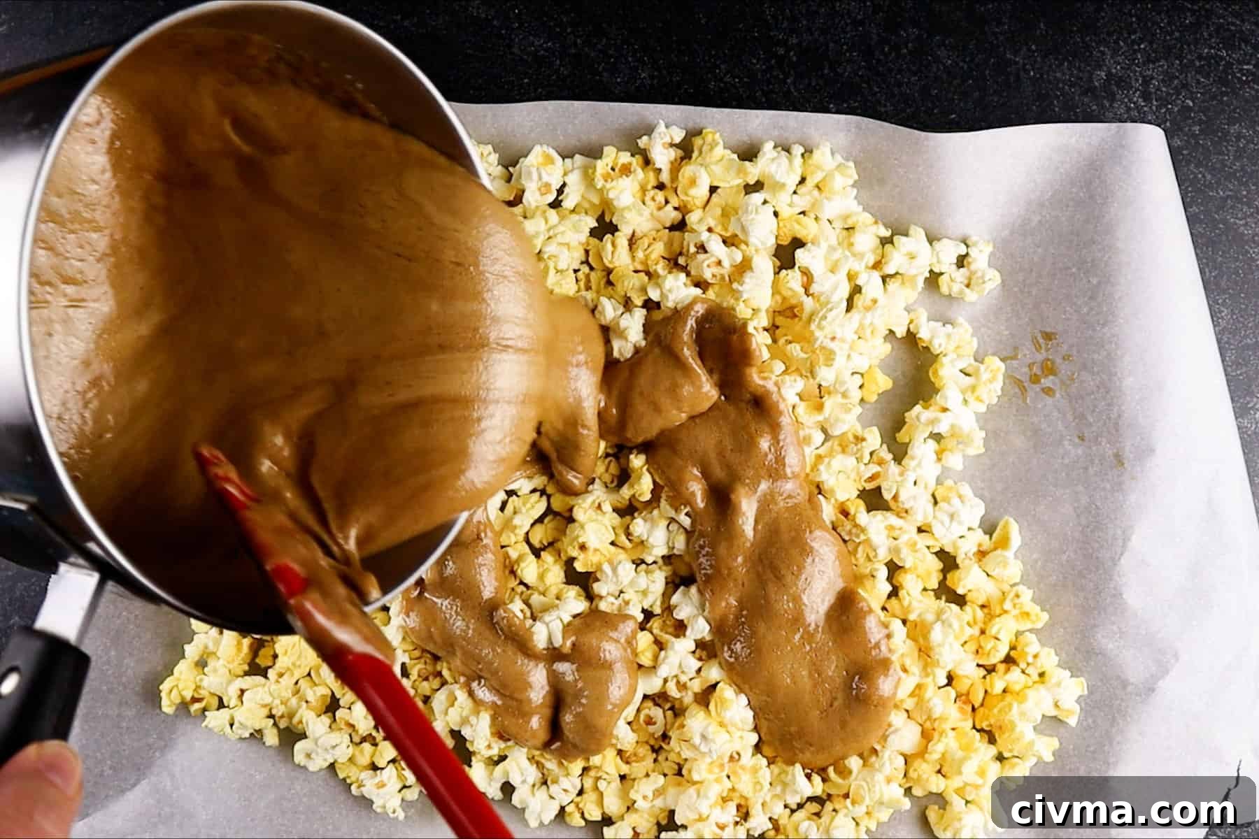 Homemade Caramel Popcorn Recipe 11 pouring caramel over popcorn
