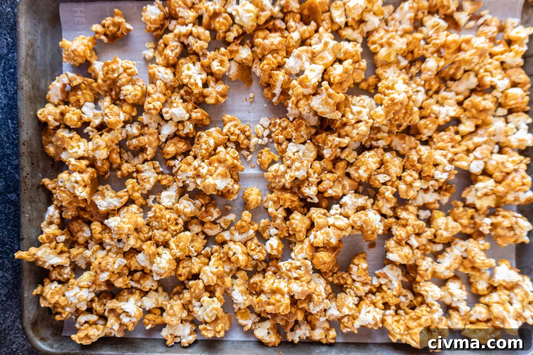 Homemade Caramel Popcorn Recipe 13 caramel popcorn after being baked on baking sheet