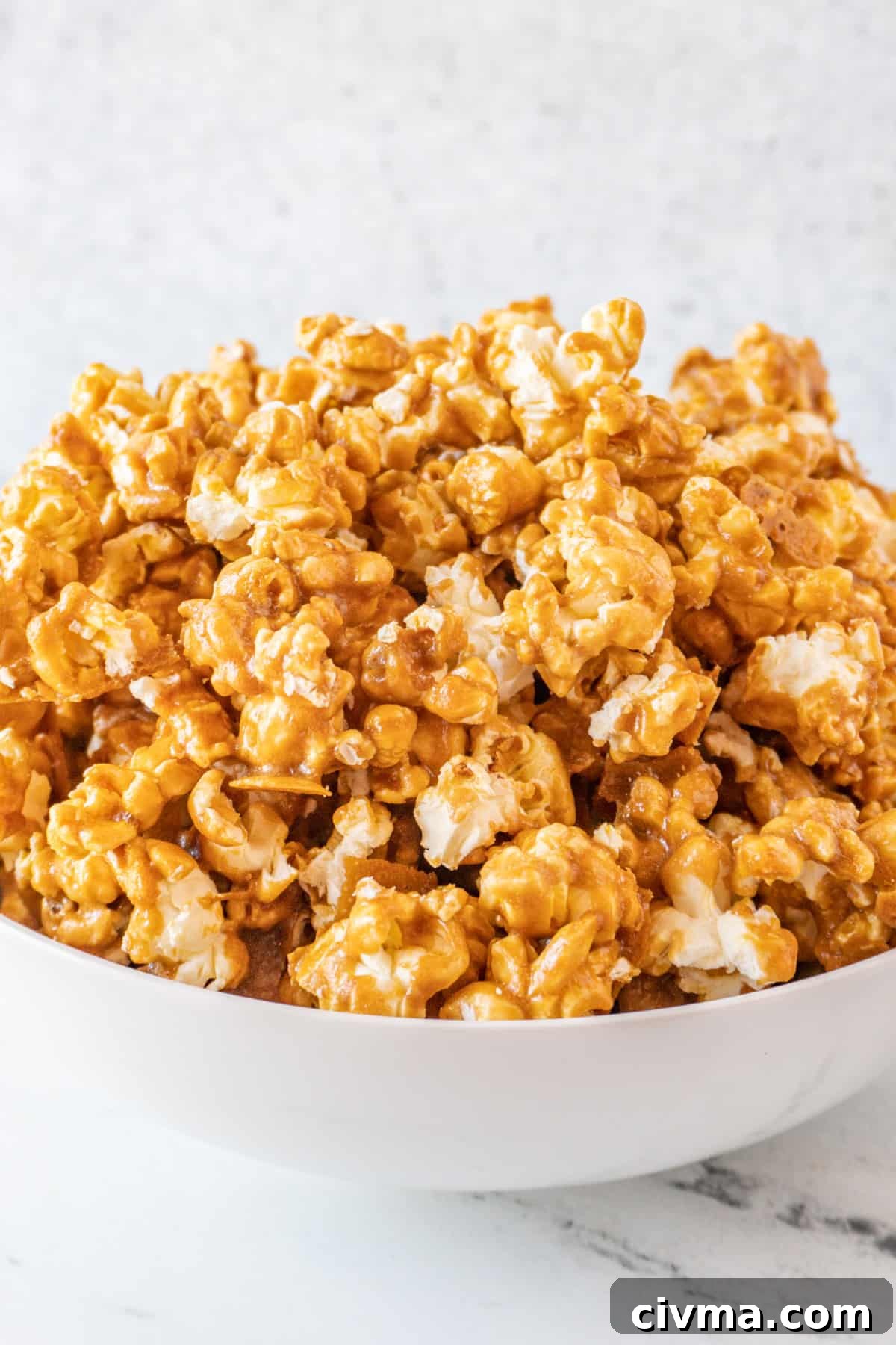 Homemade Caramel Popcorn Recipe 15 caramel popcorn piled high in large white bowl