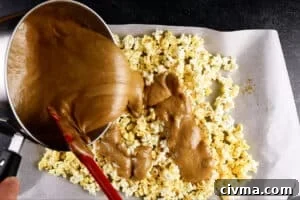 Homemade Caramel Popcorn Recipe 24 pouring caramel over popcorn
