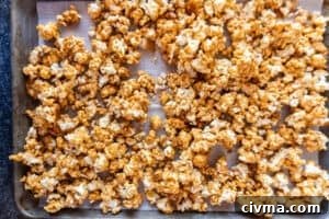 Homemade Caramel Popcorn Recipe 26 caramel popcorn after being baked on baking sheet