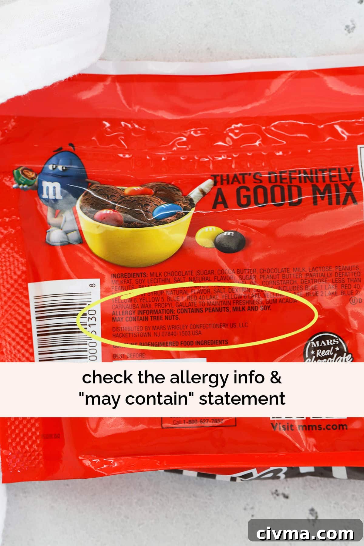 Yellow circle highlighting the may contain statement on the nutrition facts of a bag of peanut M&Ms