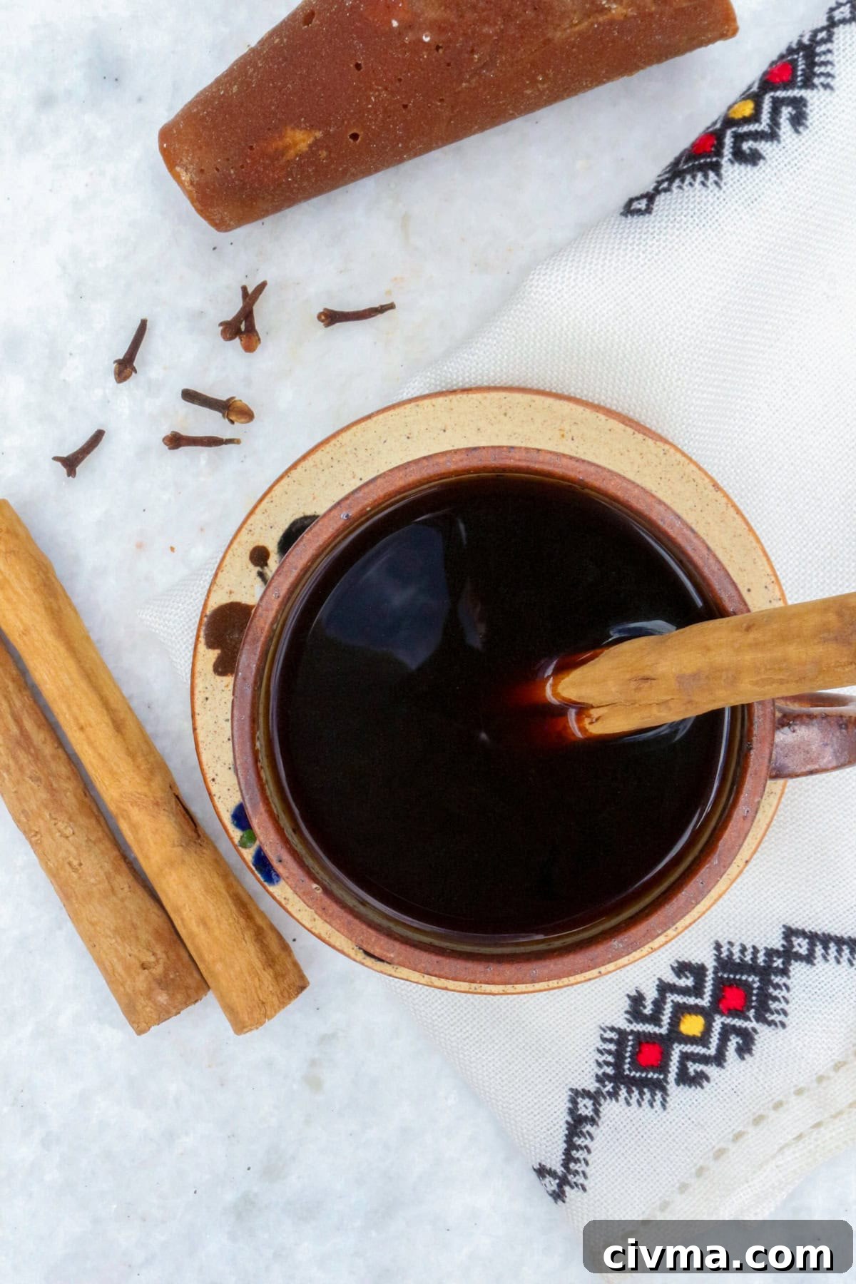 Authentic Mexican Café de Olla Recipe 8 Authentic Cafe de Olla Recipe, bird's eye of a coffee in a mug with a cinnamon stick