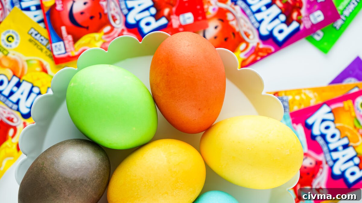 colorful kool-aid dyed easter eggs on white tray