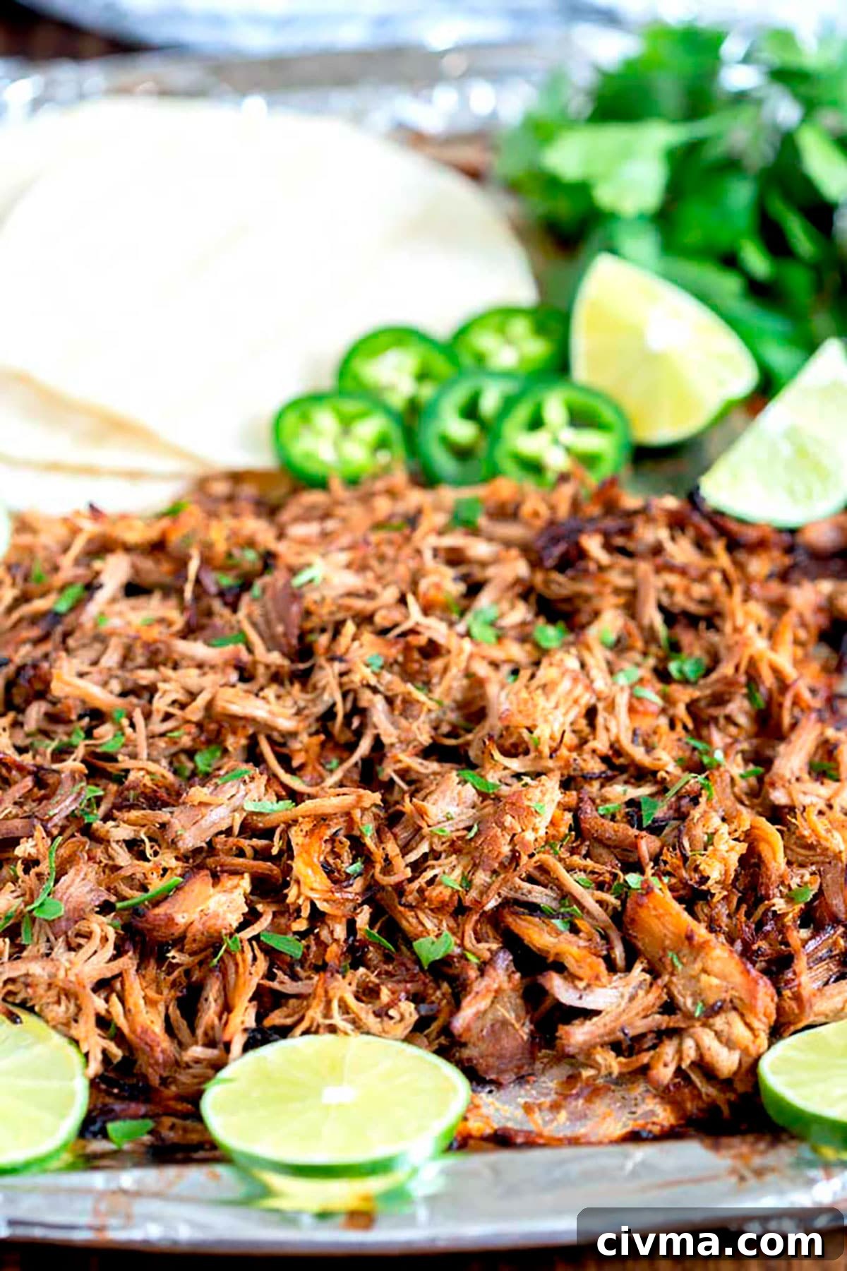 Crispy shredded pork carnitas on a sheet pan