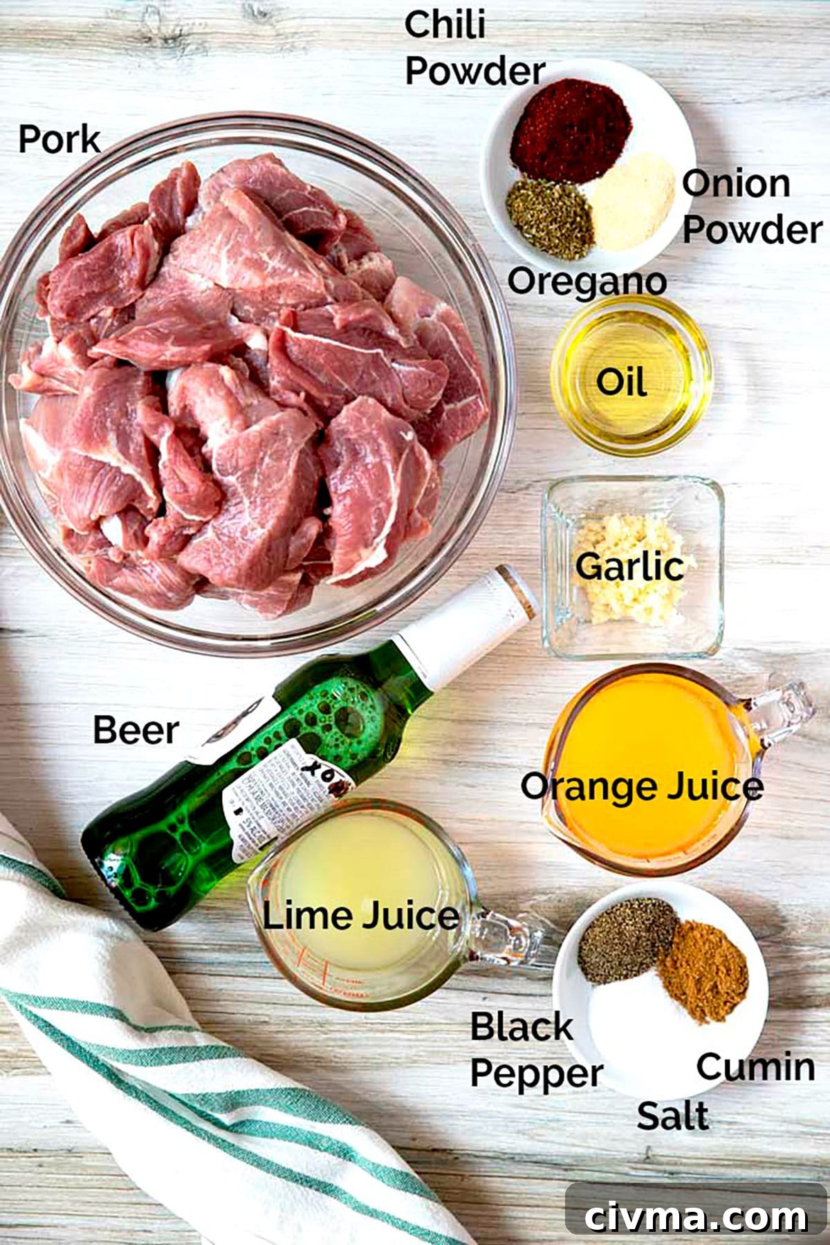 Ingredients for Instant Pot pork carnitas arranged on a white surface