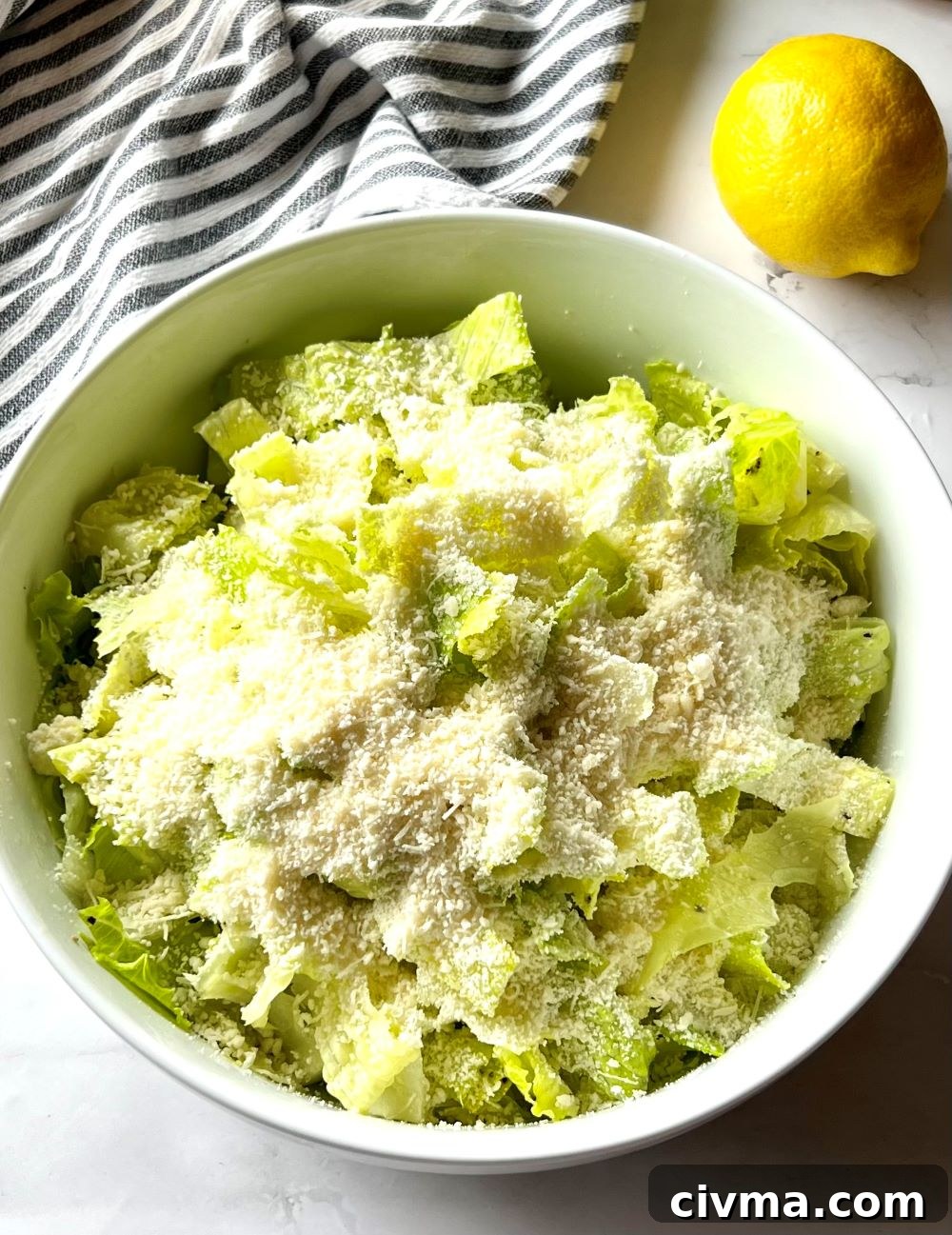 Four Ingredient Crunchy Lemon Parmesan Salad 4 Serving bowl with crunchy lemon parmesan salad.
