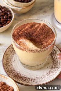 Final glass of coffee mousse dusted with cocoa