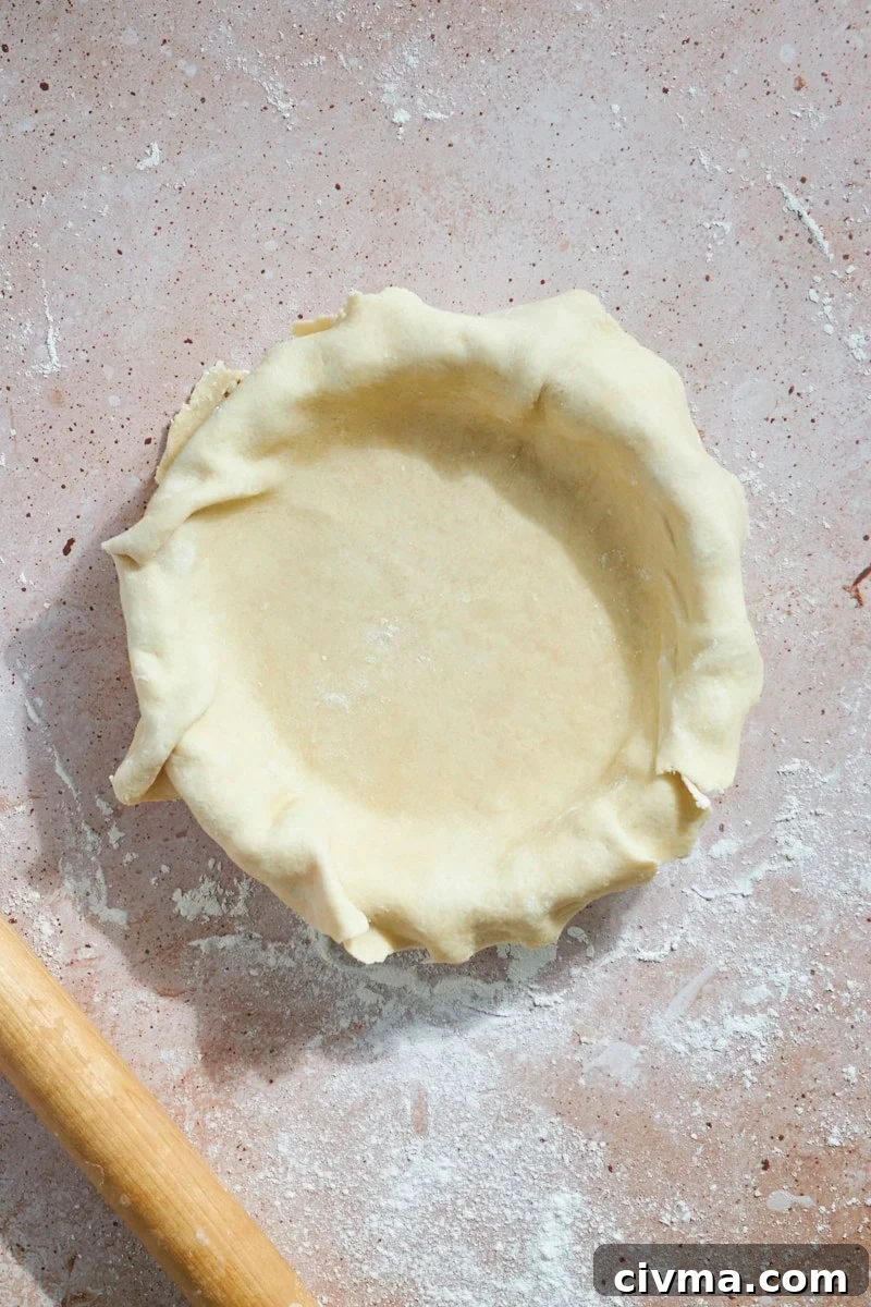 Crust laid into the pie pan.
