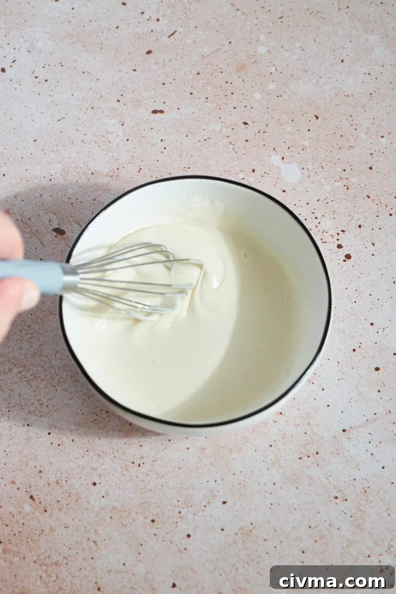Sourdough discard and vinegar mixed in a small bowl.