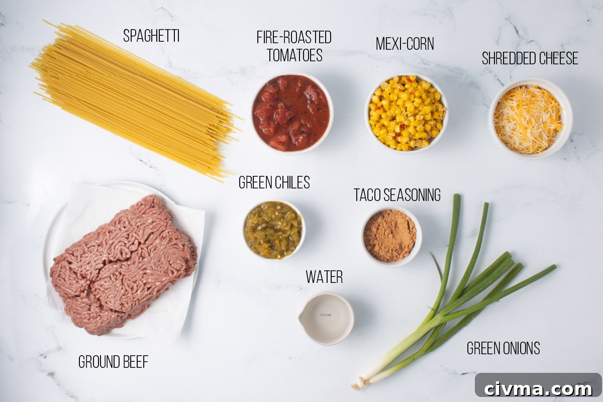 Ingredients for Mexican Spaghetti: dry spaghetti, ground beef, green chiles, green onion, mexi-corn, fire-roasted tomatoes, water, taco seasoning, and shredded cheese