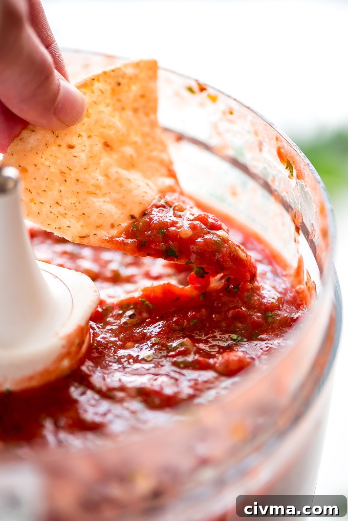 Easy homemade salsa made from roasted tomatoes, jalapenos, onion, and garlic.