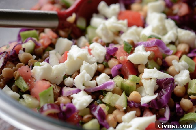 Crumbled feta cheese added to salad.