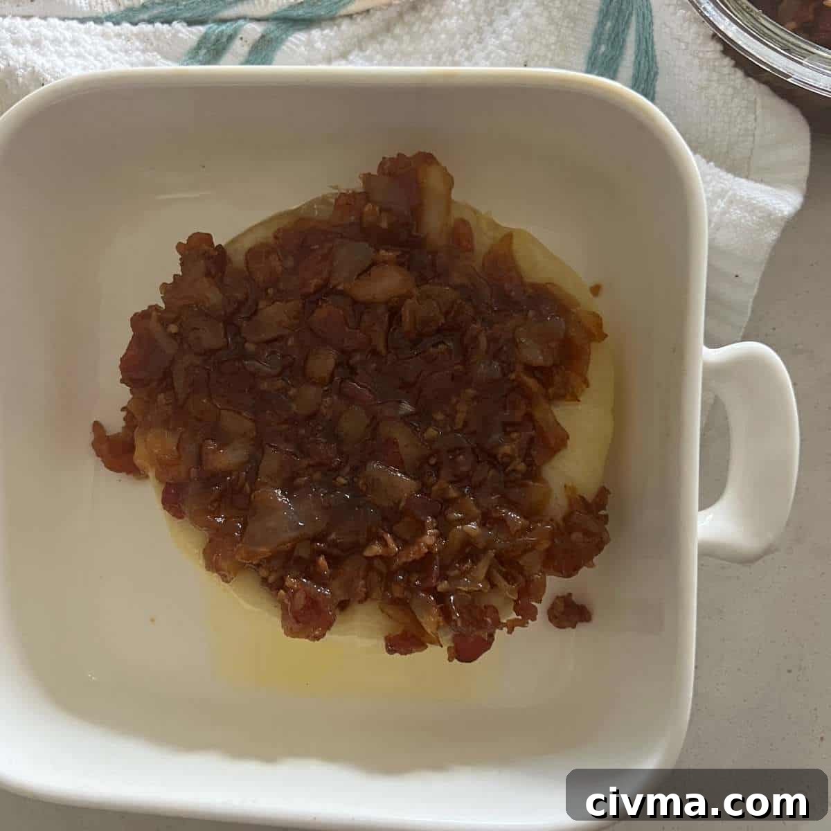 Baked brie topped with bacon onion jam.